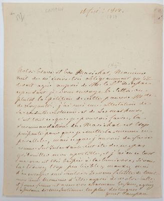 une lettre écrite à l'encre noire sur une feuille de papier