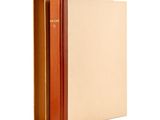 a brown book with a brown cover sitting on top of a white surface