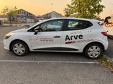 a white car that is parked in a parking lot