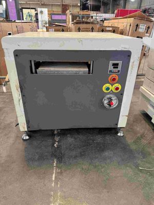 a machine that is sitting on the floor in a warehouse