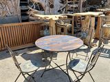 a table and chairs that are outside in the sun