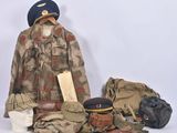 a uniform and hat on display on a white background