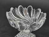 a clear glass bowl with a decorative design on it