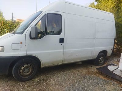 a white van that is parked on the side of the road
