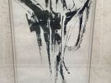 framed black and white drawing of a woman in a dress