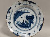 an image of a blue and white plate with a dragon on it