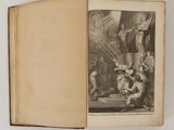 an open book with a picture of a man and a woman in a room