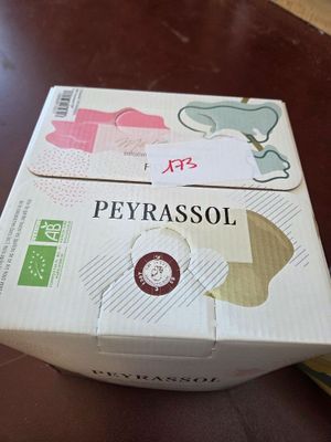 a box of cigarettes sitting on a wooden table