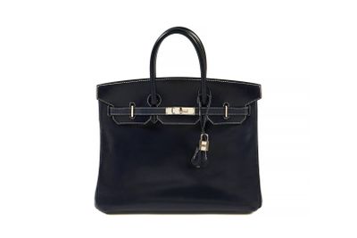 a black leather handbag on a white background