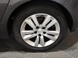 a close up of a car ' s wheel on the floor