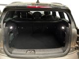 the back of a car with its trunk open and the back seats folded down