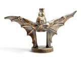 bronze figurine of a winged man with a helmet on his head