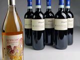 several bottles of wine sitting next to each other on a table