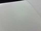 a close up of a piece of paper on a white surface