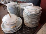 a lot of plates that are stacked on a table