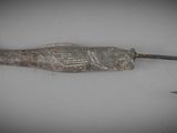 a fish shaped fishing hook with a hook on it