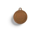a close up of a medal on a white surface