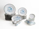 a lot of blue and white plates and cups and saucers