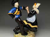 a figurine of a man and woman dancing