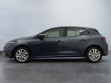 the grey car is parked on the concrete floor in the garage