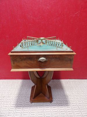 a wooden table with a chess board on top of it