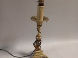 a lamp that is on a table with a light on top of it