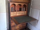 a wooden desk with a book shelf on top of it