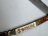 a knife that has been cut in half with a sharp blade