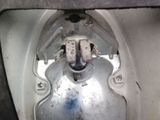 a close up view of a toilet with a metal tank