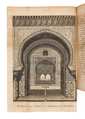 un livre ouvert dans lequel figure l'image d'un bâtiment