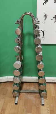 a pair of dumbs on a metal rack in a room