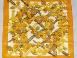 an image of a square scarf with a bunch of flowers on it
