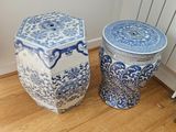 two blue and white vases on the floor next to a radiator
