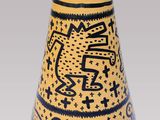 a vase with a design on it on a gray background