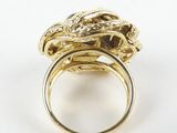 a close up of a gold ring with a dragon head on it