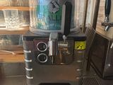 a machine that is sitting on the counter in the kitchen