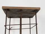 a wooden shelf with two metal bars on it