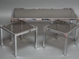pair of chrome and glass side tables with a glass top