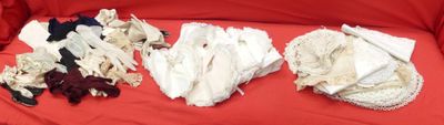 several pieces of cloth are laid out on a red cloth