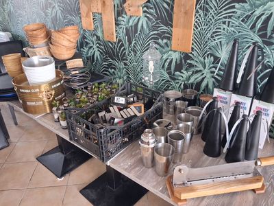 many pots and pans on a table in a room