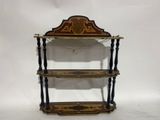 an antique wooden shelf with three shelves on top of it
