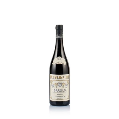 a bottle of wine sitting on top of a white surface