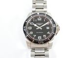 a close up of a watch on a white surface