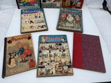 several children ' s books are lined up on a table