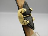 an image of a close up of a watch on a display stand