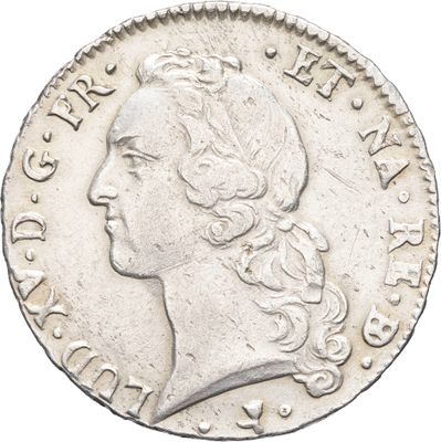 gros plan d'une pièce de monnaie sur laquelle figure une tête de femme