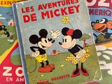mickey and minnie mouse books are stacked on top of each other