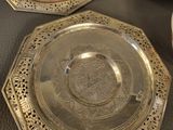 two plates and a bowl sitting on a table