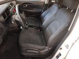 the interior of a car with a steering wheel and black seats