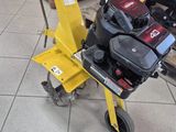 a small yellow machine that is sitting on the floor